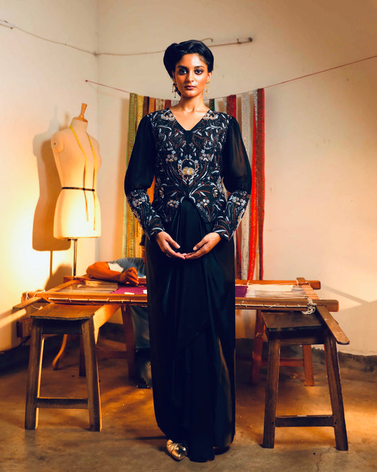 Black silk jacket with a fluid modal skirt.