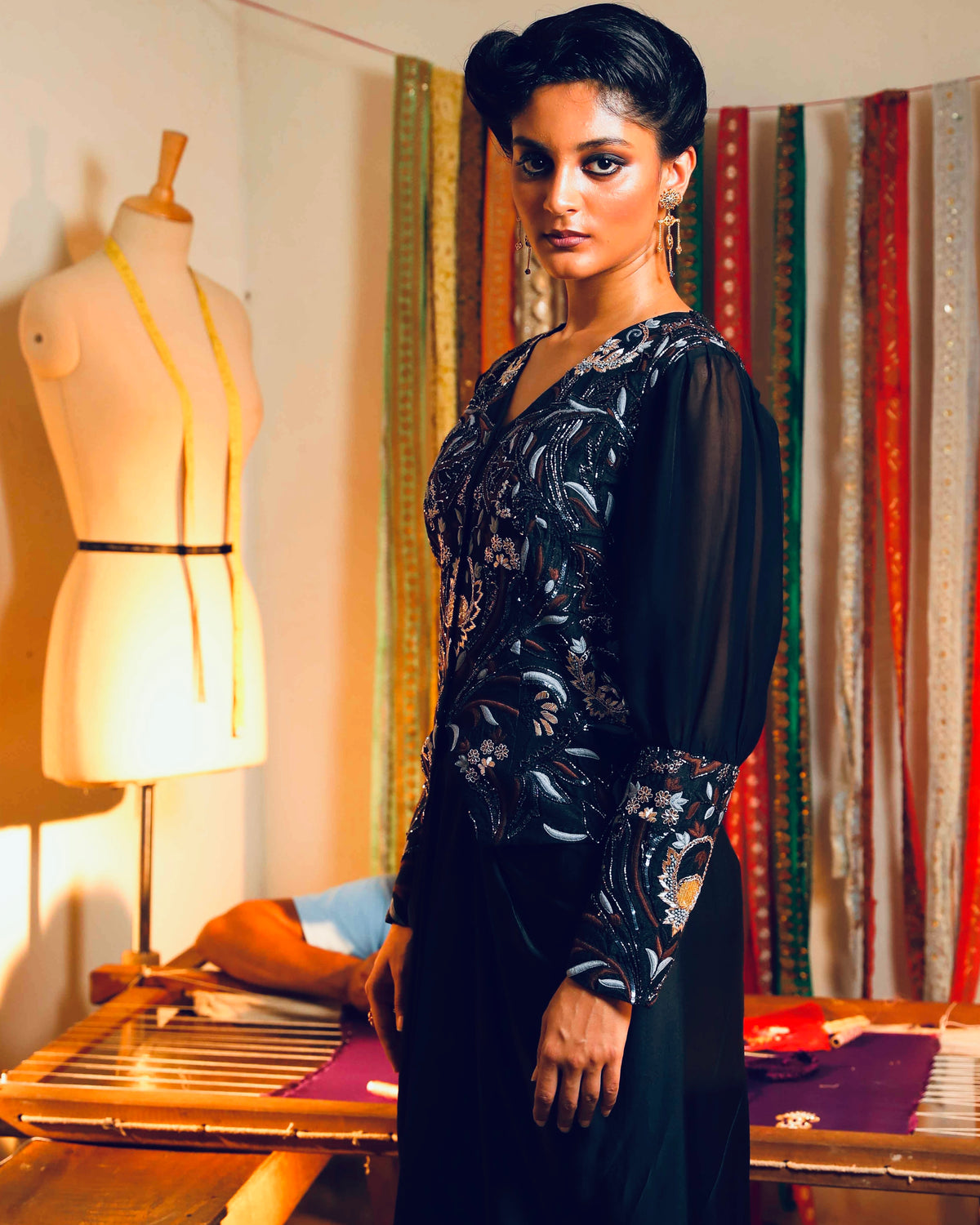 Black silk jacket with a fluid modal skirt.