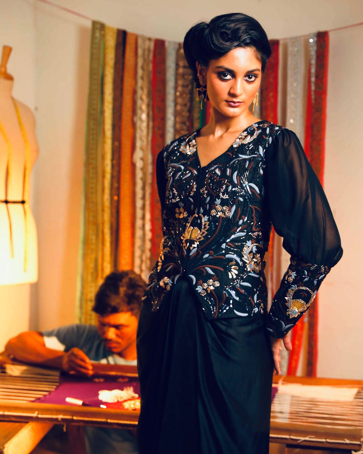 Black silk jacket with a fluid modal skirt.